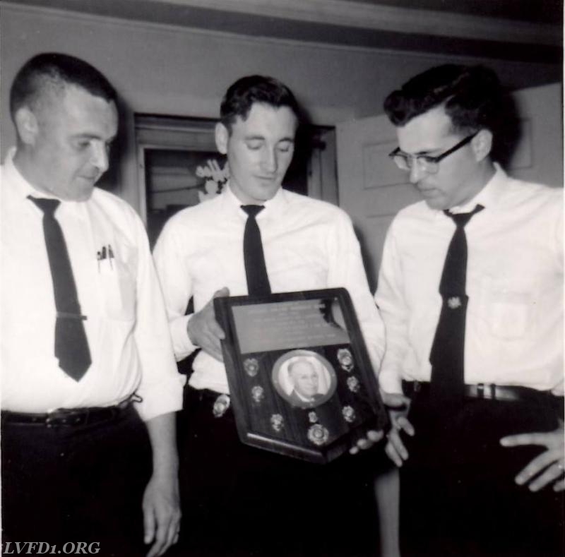 1959: Jake Mattingly, Bobby Hammett & Jack Candela. Bobby was Trophy Committee Chairman. Reviewing the plaque recognizing Roland Duke Testimonial Dinner. Photo credit: Brian Hammett